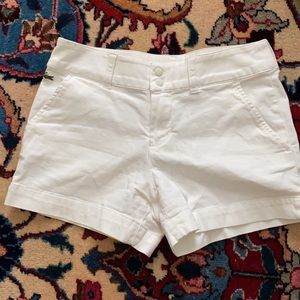 White Lacoste shorts